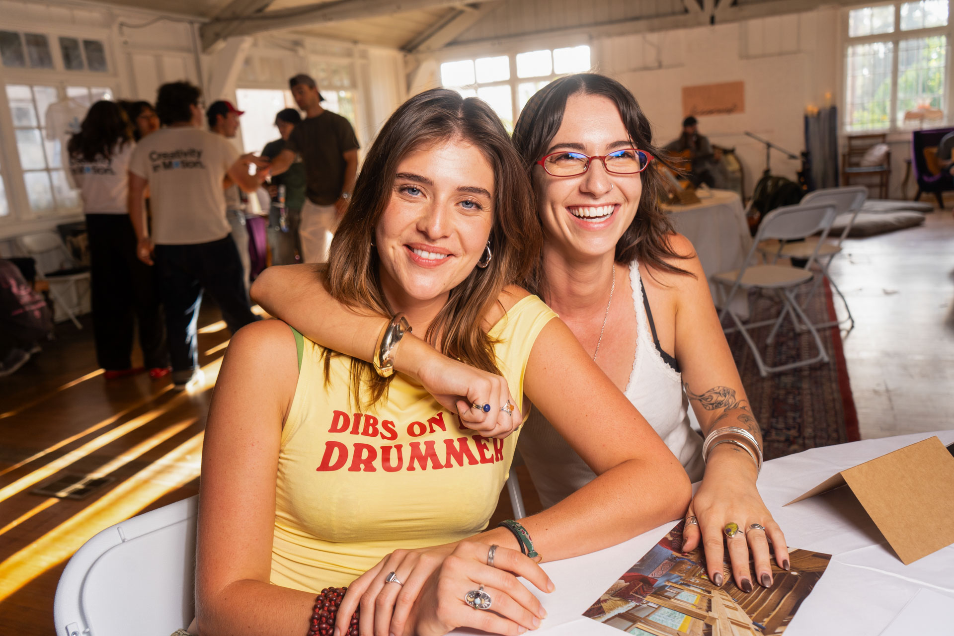 Two creatives smiling at a PLAYE community event