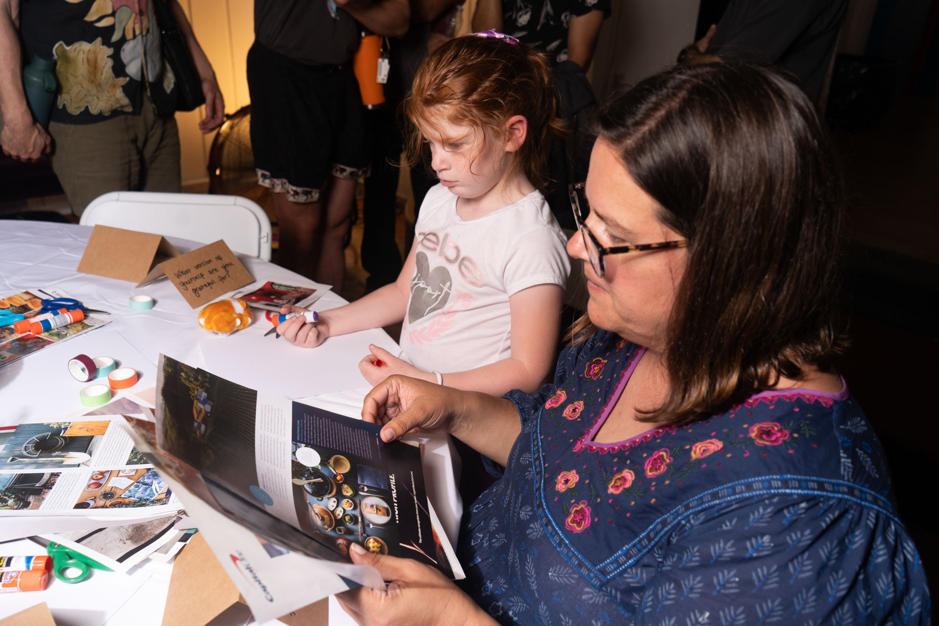 Members making things by hand at a PLAYE workshop table